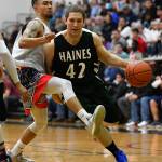 Angoons Aquino Brinson attempts to stay in front of Haines Kyle Fossman in the B final at the Gold Medal Basketball Tournament on Saturday, March 23, 2019. Haines won 88-80. (Michael Penn | Juneau Empire)