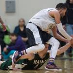 Haines Brian Combs, below, and Hydaburgs Clayton Edwin chase a loose ball the B final at the Gold Medal Basketball Tournament on Saturday, March 23, 2019. Haines won 88-80. (Michael Penn | Juneau Empire)