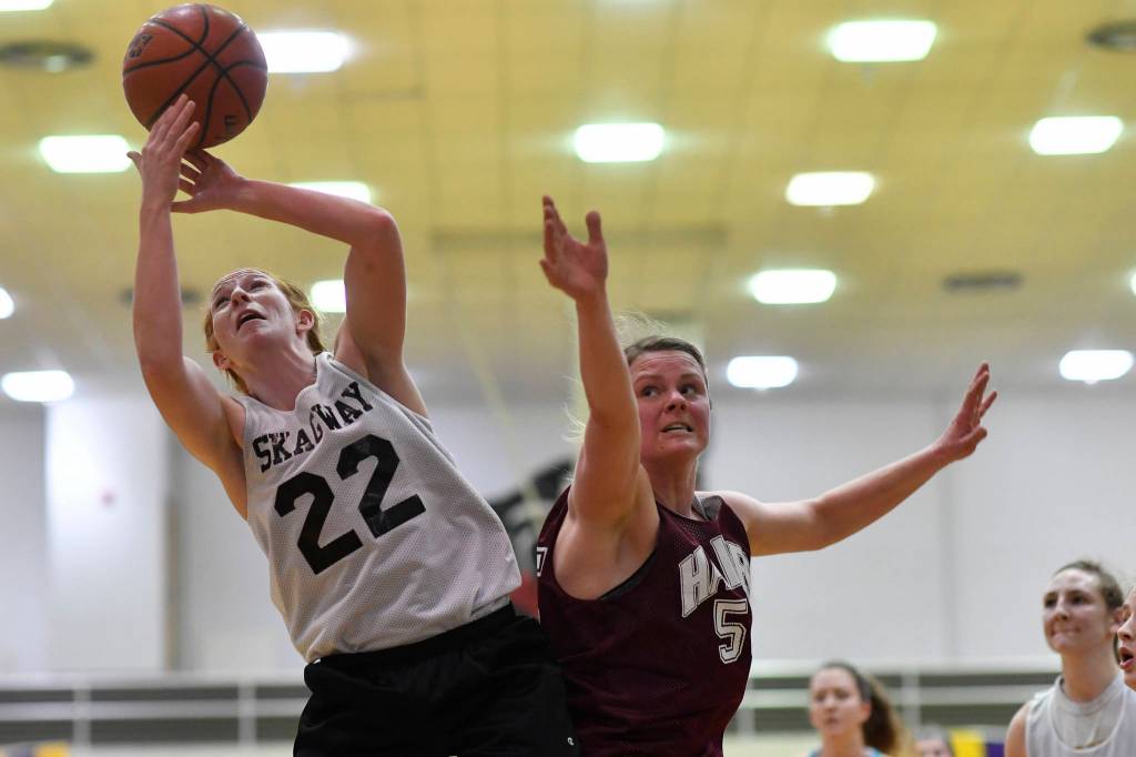 Skagways Jesse Ellis, left, beats Haines Alisa Beske to a rebound in the womens final at the Gold Medal Basketball Tournament on Saturday, March 23, 2019. Skagway won 58-49. (Michael Penn | Juneau Empire)
