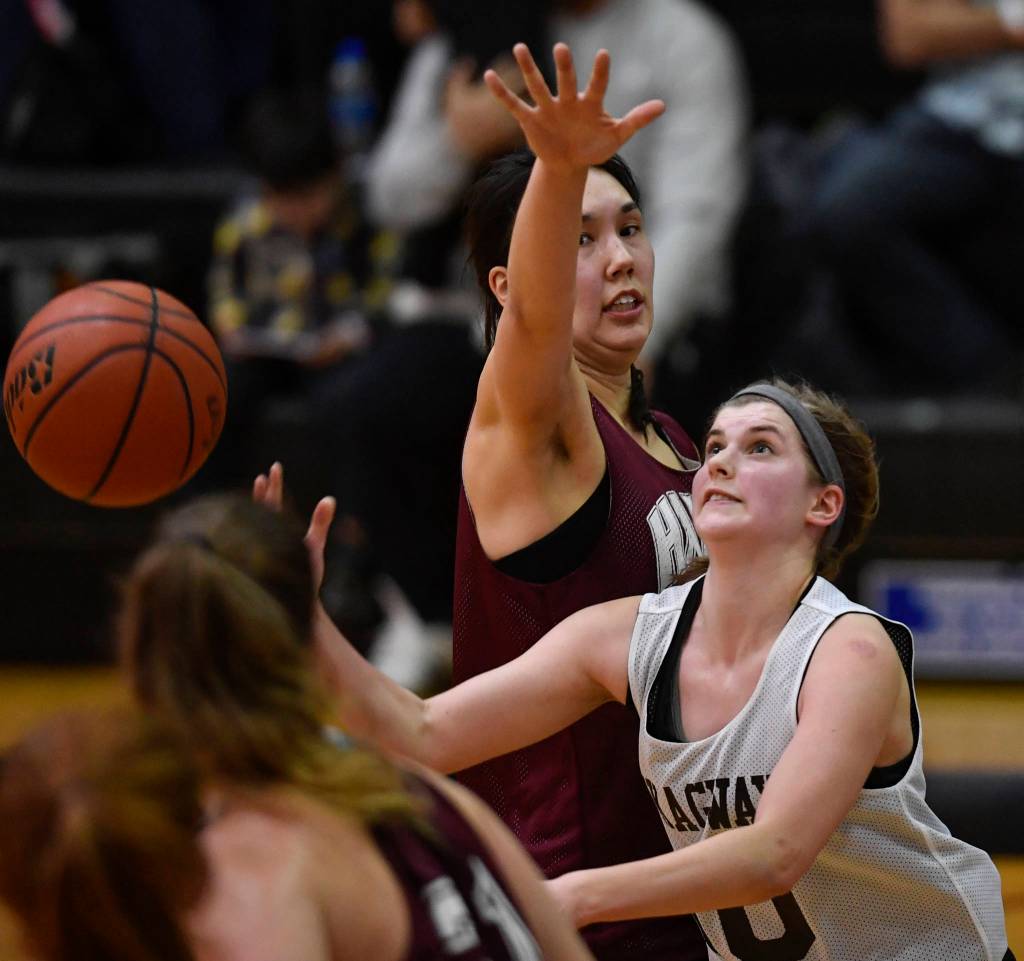 Skagways Kaylie Smith, right, shoots against Haines Fran Daly in the womens final at the Gold Medal Basketball Tournament on Saturday, March 23, 2019. (Michael Penn | Juneau Empire)