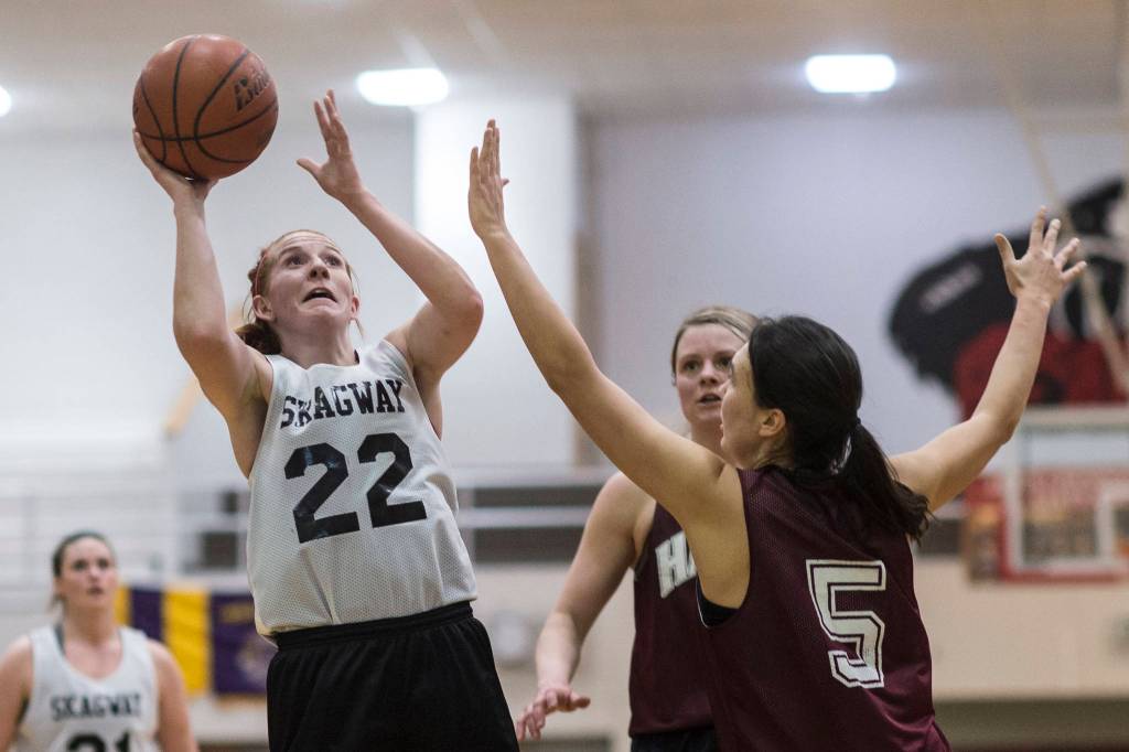 Skagway Jesse Ellis, left, shoots against Haines Fran Daly, right, in the womens final at the Gold Medal Basketball Tournament on Saturday, March 23, 2019. Skagway won 58-49. (Michael Penn | Juneau Empire)