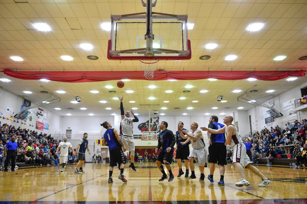 Klukwans Jason Shull shoots under the basket against Hydaburg in the C final at the Gold Medal Basketball Tournament on Saturday, March 23, 2019. Hydaburg won 93-81. (Michael Penn | Juneau Empire)