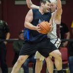 Hydaburgs Fred Hamilton and Klukwans Brian Friske knock heads in the C final at the Gold Medal Basketball Tournament on Saturday, March 23, 2019. Hydaburg won 93-81. (Michael Penn | Juneau Empire)