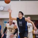 Hydaburgs Ben Young, right, steals the ball from Klukwans Jason Shull in the C final at the Gold Medal Basketball Tournament on Saturday, March 23, 2019. Hydaburg won 93-81. (Michael Penn | Juneau Empire)