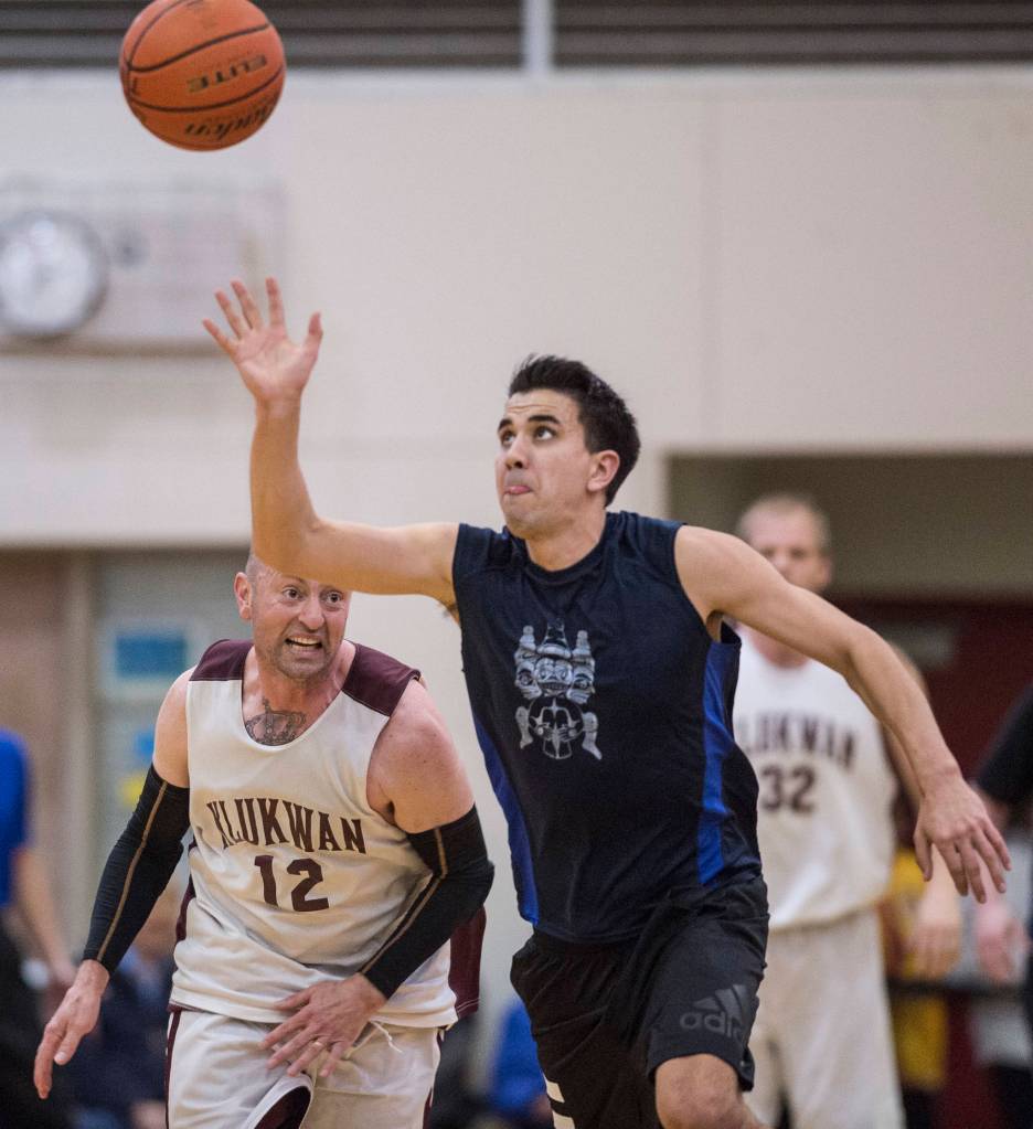 Hydaburgs Ben Young, right, steals the ball from Klukwans Jason Shull in the C final at the Gold Medal Basketball Tournament on Saturday, March 23, 2019. Hydaburg won 93-81. (Michael Penn | Juneau Empire)
