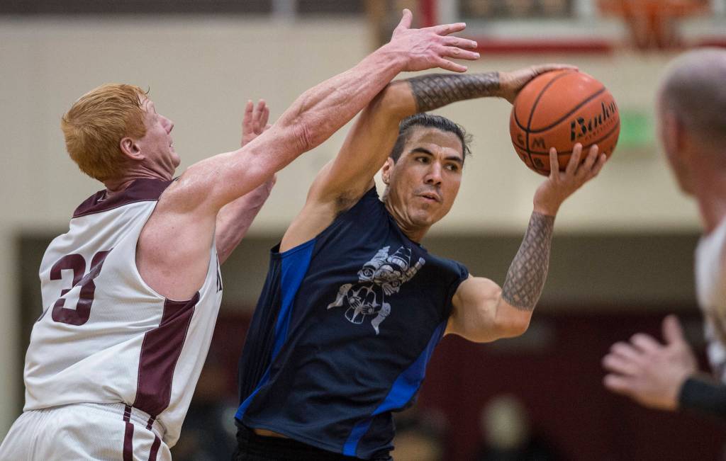 Klukwans Jesse McGraw, left, pressures Hydaburgs TJ Young in the C final at the Gold Medal Basketball Tournament on Saturday, March 23, 2019. Hydaburg won 93-81. Young won the MVP award. (Michael Penn | Juneau Empire)