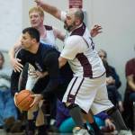 Klukwans Jesse McGraw, center, and Stuart DeWitt, right, pressure Hydaburgs Kevin Young in the C final at the Gold Medal Basketball Tournament on Saturday, March 23, 2019. Hydaburg won 93-81. (Michael Penn | Juneau Empire)