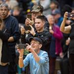 Family and friends photograph the winning Hydaburg team after they beat Klukwan in the C final at the Gold Medal Basketball Tournament on Saturday, March 23, 2019. Hydaburg won 93-81. (Michael Penn | Juneau Empire)