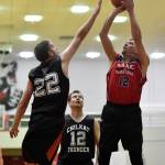 Kakes Lloyd Davis, right, shoots over Klukwans Dave Buss in the Masters final at the Gold Medal Basketball Tournament on Saturday, March 23, 2019. Kake won 75-64. (Michael Penn | Juneau Empire)