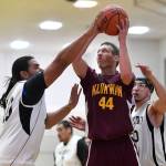 Klukwans Andrew Friske, center, shoots against Yakutats Derek James, left, at the Juneau Lions Club 73rd Annual Gold Medal Basketball Tournament at Juneau-Douglas High School: Yadaa.at Kalé on Tuesday, March 19, 2019. Friske was the recipient of the Dr. Walter A. Soboleff Award for his outstanding community involvement among other traits. (Michael Penn | Juneau Empire File)