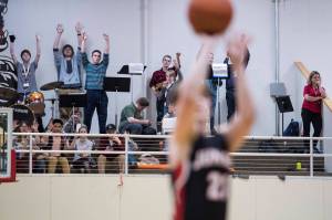 Juneau-Douglas Pep Band members show their claws as a JDHS player shoots a free throw against Maine-Endwell at the Princess Cruises Capital City Classic at Juneau-Douglas High School on Saturday, Dec. 29, 2018. Juneau-Douglas won 66-61. (Michael Penn | Juneau Empire File)