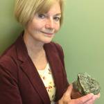 Geologist Marti Miller with a 2 billion-year-old rock she collected near Iditarod. (Courtesy Photo | Adrian Bender)