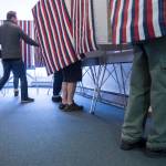 In this Nov. 6, 2018 photo, voters fill the voting booths at Glacier Valley Baptist Church on Election Day. (Michael Penn | Juneau Empire File)