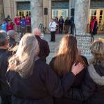 Juneau residents listen to James Biela, lead field advocate the Alaska Chapter of the American Foundation for Suicide Prevention, as he speaks at a candlelight vigil to raise awareness at the Capitol on Tuesday, March 26, 2019. (Michael Penn | Juneau Empire)