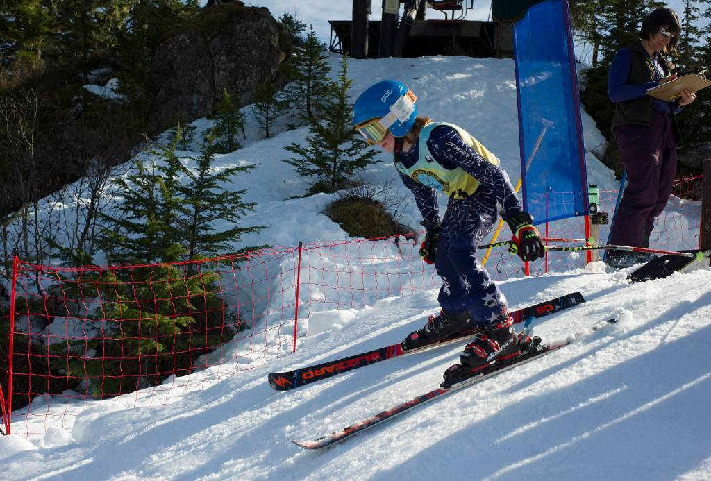 Alyeska Ski Clubs Austin Murphy takes off from the top of Hooter Chairlift during the second run of the Giant Slalom of the U12/U14 Alaska State Championships at Eaglecrest Ski Area on Saturday, March 30, 2019. (Nolin Ainsworth | Juneau Empire)