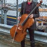 April 7, 2019: I ran into Finn Morley at an informal gathering as the Fairweather ferry departed Juneau. Finn, a 10th grader at Juneau-Douglas High School, played the Alaska Flag Song for the occasion. He dressed for the event in a dark gray suit jacket by Asos, burgundy button-down shirt by Express, pants by Kraft and maroon shoes by Saucony. The cello, which he played exquisitely, is from Jay Haide. He has played since the fourth grade after he got acquainted with the instrument in Ecuador.