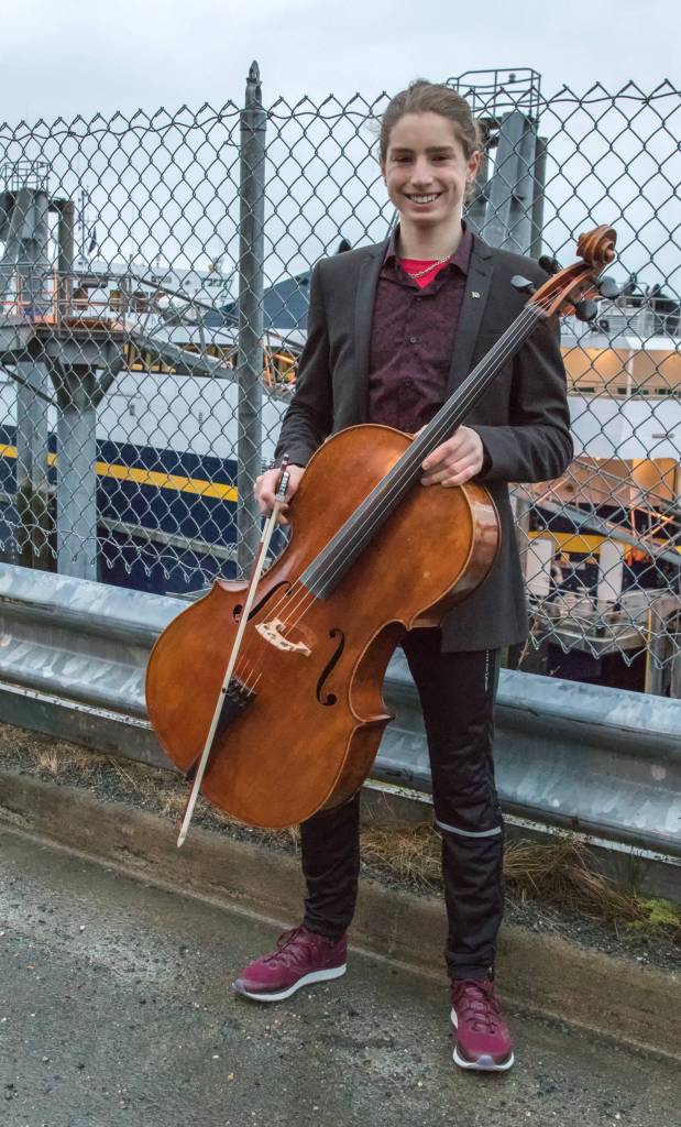 April 7, 2019: I ran into Finn Morley at an informal gathering as the Fairweather ferry departed Juneau. Finn, a 10th grader at Juneau-Douglas High School, played the Alaska Flag Song for the occasion. He dressed for the event in a dark gray suit jacket by Asos, burgundy button-down shirt by Express, pants by Kraft and maroon shoes by Saucony. The cello, which he played exquisitely, is from Jay Haide. He has played since the fourth grade after he got acquainted with the instrument in Ecuador.