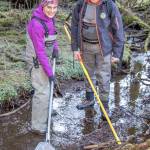 April 21, 2019: Even on a field work day, Nicole Legere and Dylan Krull, Habitat Biologists with the Alaska Department of Fish and Game manage to look sharp and well-dressed for the task. This day they were electrofishing a small tributary to Auke Lake looking for coho salmon. Both are wearing waders and boots by Simms and ADF&G logo jackets from Drift Creek Outdoors. Their most important accessory: a Smith Root LR-24 backpack electrofisher. They found coho!