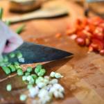 Erin Anais Heist prepares a spaghetti squash, prawns, bacon and egg breakfast dish in her home kitchen on Thursday, March 28, 2019. (Michael Penn | Juneau Empire)