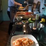 Erin Anais Heist prepares a spaghetti squash, prawns, bacon and egg breakfast dish in her home kitchen on Thursday, March 28, 2019. (Michael Penn | Juneau Empire)