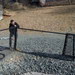 Dave McCasland, owner of Deckhand Daves Fish Tacos, takes down a section of fencing on Tuesday, April 2, 2019, as he prepares to move his food truck business onto the vacant lots that were formerly the Gastineau Apartments and Gunakadeit Park. The City and Borough of Juneau Assembly OKd an ordinance and a resolution that allows for a food court in the area. (Michael Penn | Juneau Empire)