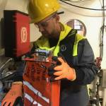 NTSB investigator Brice Banning holds a flight recorder from a Beechcraft B200 that was recovered from the ocean waters of Fredrick Sound near Kake. Alaska. The airplane crashed on Jan. 29, 2019 while on approach to the Kake Airport. The airplane was being operated by Guardian Flight as an air ambulance flight. (Courtesy Photo | National Transportation Safety Board)
