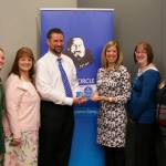 Employees of Shattuck & Grummett Insurance with their award. (Courtesy Photo)
