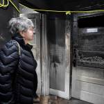 Ernestine Hayes gives a tour of her fire-damaged house at the corner of 5th and Franklin Street on Wednesday, April 3, 2019. (Michael Penn | Juneau Empire)