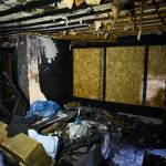 Ernestine Hayes gives a tour of her fire-damaged house at the corner of 5th and Franklin Street on Wednesday, April 3, 2019. (Michael Penn | Juneau Empire)
