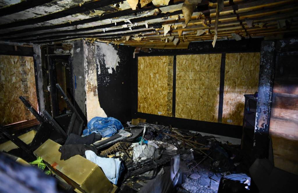 Ernestine Hayes gives a tour of her fire-damaged house at the corner of 5th and Franklin Street on Wednesday, April 3, 2019. (Michael Penn | Juneau Empire)