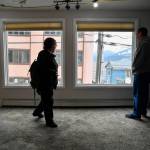 Ernestine Hayes, with her son, Joshua Stephenson, gives a tour of her fire-damaged house at the corner of Fifth and Franklin Street on Wednesday, April 3, 2019. (Michael Penn | Juneau Empire)