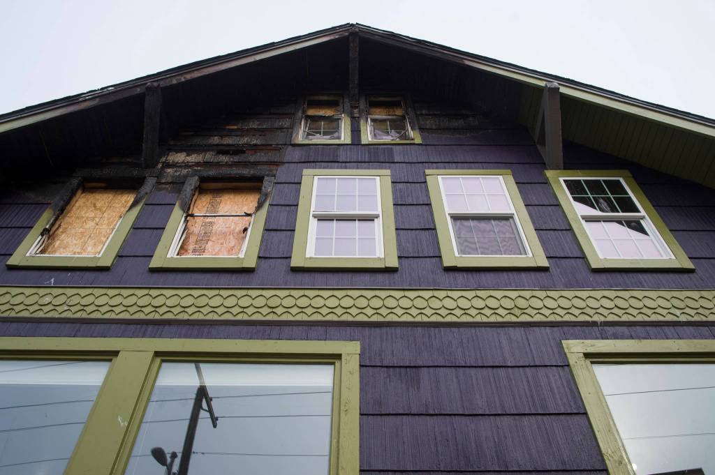 Ernestine Hayes gives a tour of her fire-damaged house at the corner of 5th and Franklin Street on Wednesday, April 3, 2019. (Michael Penn | Juneau Empire)
