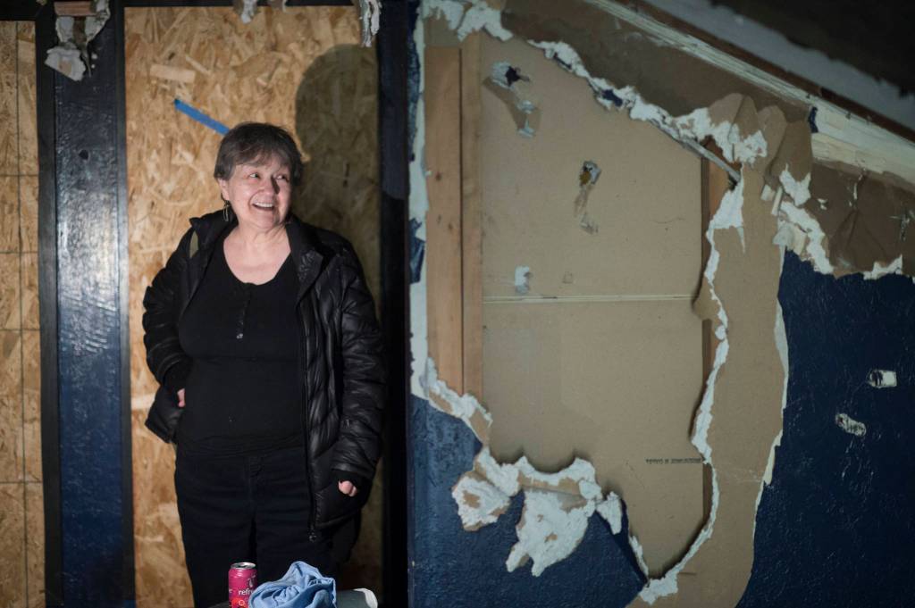 Ernestine Hayes gives a tour of her fire-damaged house at the corner of 5th and Franklin Street on Wednesday, April 3, 2019. (Michael Penn | Juneau Empire)