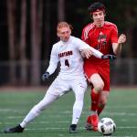 Juneau-Douglas Jake Marnon, right, competes against Clarksons Seth Brown at Adair-Kennedy Memorial Field on Wednesday, April 3, 2019. Clarkson won 1-0. (Michael Penn | Juneau Empire)