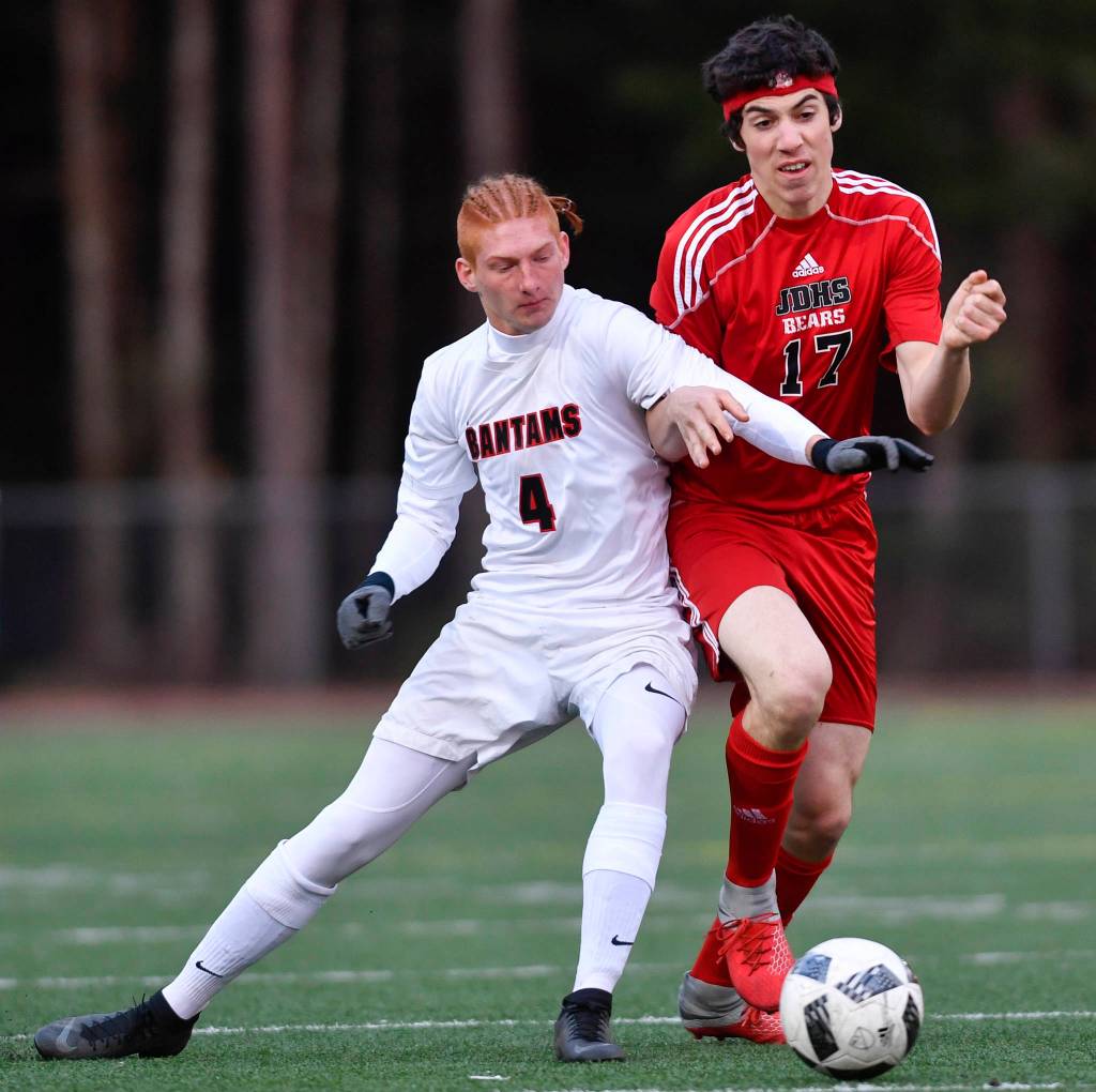 Juneau-Douglas Jake Marnon, right, competes against Clarksons Seth Brown at Adair-Kennedy Memorial Field on Wednesday, April 3, 2019. Clarkson won 1-0. (Michael Penn | Juneau Empire)