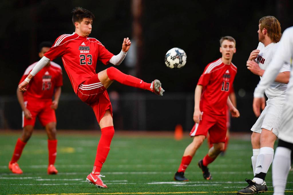 Juneau-Douglas Kaiden Wilshusen clears the ball against Clarkson at Adair-Kennedy Memorial Field on Wednesday, April 3, 2019. Clarkson won 1-0. (Michael Penn | Juneau Empire)