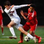 Juneau-Douglas Finn Yerkes, right, competes against Clarksons Robert Hubbard at Adair-Kennedy Memorial Field on Wednesday, April 3, 2019. Clarkson won 1-0. (Michael Penn | Juneau Empire)