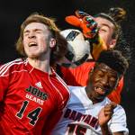 Clarksons goalie Alessandro Italia, top, and teammate Steve Baiye, right, fend off a header attempt by Juneau-Douglas Kanon Goetz at Adair-Kennedy Memorial Field on Wednesday, April 3, 2019. Clarkson won 1-0. (Michael Penn | Juneau Empire)