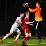 Clarksons goalie Alessandro Italia gathers the ball in front of Juneau-Douglas Koby Goldstein at Adair-Kennedy Memorial Field on Wednesday, April 3, 2019. Clarkson won 1-0. (Michael Penn | Juneau Empire)