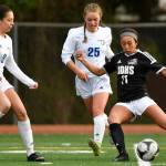 Juneau-Douglas Malia Miller, right, shoots and scores JDHSs first goal against Thunder Mountains Kiah Dihle, center, and Keana Villanueva at Adair-Kennedy Memorial Field on Wednesday, April 3, 2019. JDHS won 8-0. (Michael Penn | Juneau Empire)                                Juneau-Douglas Malia Miller, right, shoots and scores JDHSs first goal against Thunder Mountains Kiah Dihle, center, and Keana Villanueva at Adair-Kennedy Memorial Field on Wednesday, April 3, 2019. JDHS won 8-0. (Michael Penn | Juneau Empire)
