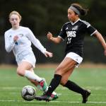 Juneau-Douglas Malia Miller, right, moves the ball against Thunder Mountains Ellie Knapp at Adair-Kennedy Memorial Field on Wednesday, April 3, 2019. JDHS won 8-0. (Michael Penn | Juneau Empire)