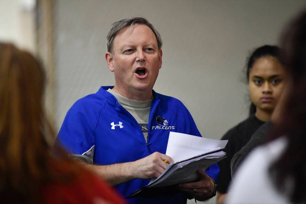 Coach John Boucher speaks to his players during Thunder Mountain High School softball practice at the Wells Fargo Dimond Park Field House on Tuesday, April 2, 2019. (Michael Penn | Juneau Empire)