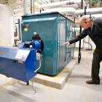 Curtis Blackwell, Maintenance Supervisor for the Juneau School District, shows on Monday, April 8, 2018, how high the water came up on one of the two boilers at the Marie Drake building during a flooding event at the school on Friday. Spare parts were found to get the boiler running and the school open. A corroded pipe at the base of a hot water tank was the source of the leak. (MIchael Penn | Juneau Empire)