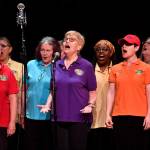 Members of the PFLAG/Juneau Pride Chorus perform at the 45th annual Alaska Folk Festival at Centennial Hall on Monday, April 8, 2019. (Michael Penn | Juneau Empire)