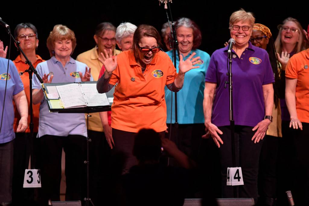 Members of the PFLAG/Juneau Pride Chorus perform at the 45th annual Alaska Folk Festival at Centennial Hall on Monday, April 8, 2019. (Michael Penn | Juneau Empire)