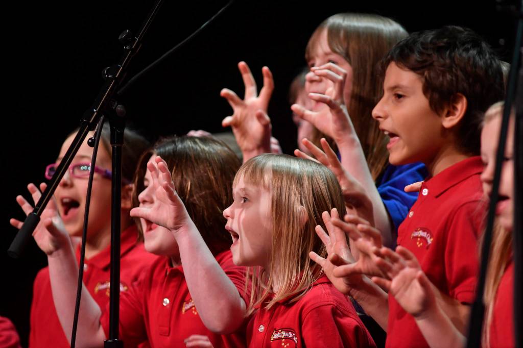 Members of the Alaska Youth Choir perform at the 45th annual Alaska Folk Festival at Centennial Hall on Monday, April 8, 2019. (Michael Penn | Juneau Empire)