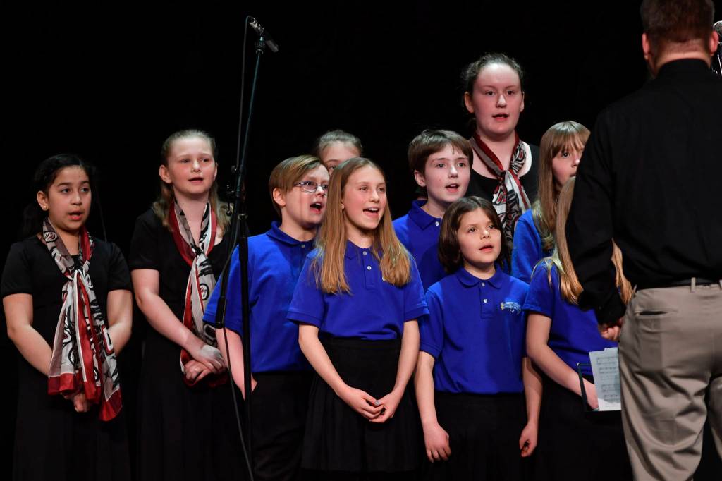 Members of the Alaska Youth Choir perform at the 45th annual Alaska Folk Festival at Centennial Hall on Monday, April 8, 2019. (Michael Penn | Juneau Empire)