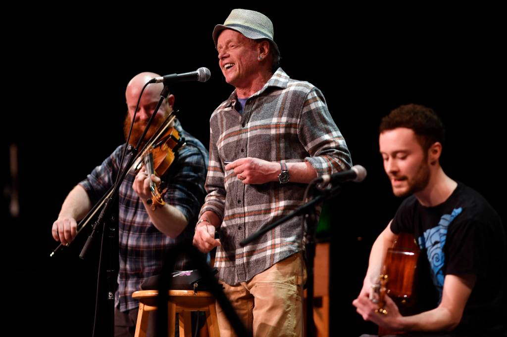 Tim Triggs, Zane Jones and Nate Wiley of the Wileys Coyotes, of Boulder, Colorado, perform at the 45th annual Alaska Folk Festival at Centennial Hall on Monday, April 8, 2019. (Michael Penn | Juneau Empire)