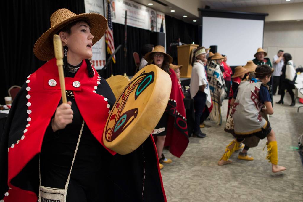 Members of the Xaadaas Dagwii Dance Group enter the Elizabeth Peratrovich Hall for the opening of the 84th annual Tribal Assembly of the Central Council of Tlingit and Haida Indian Tribes of Alaska on Wednesday, April 10, 2019. (Michael Penn | Juneau Empire)