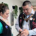 Seattle Delegate Jessica Dominy shares contact information with Shawaan Jackson-Gamble, who was elected emerging leader during the last day of Central Council of Tlingit and Haida Indian Tribes of Alaskas 84th annual Tribal Assembly, Friday, April 12, 2019. (Ben Hohenstatt | Juneau Empire)